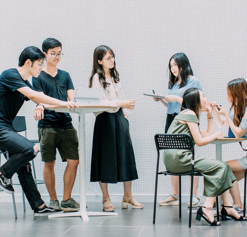 two men and four women studying PMP exam